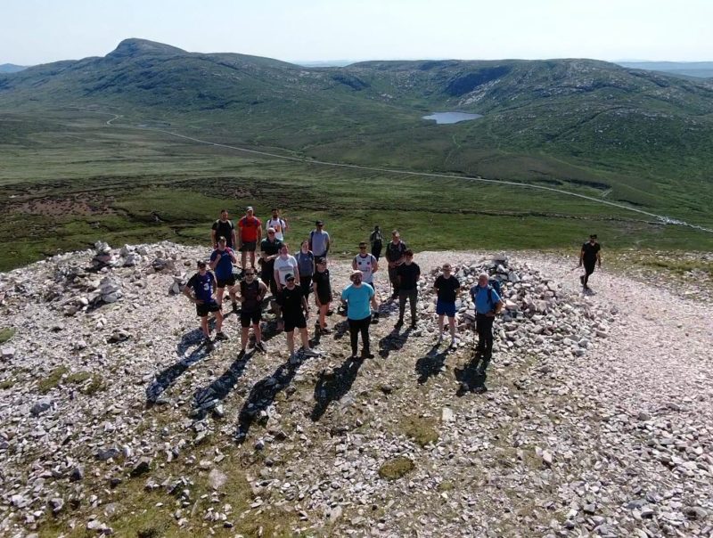 a photo of mcmenamin engineering and mantis cranes staff who climber mount errigal for charity